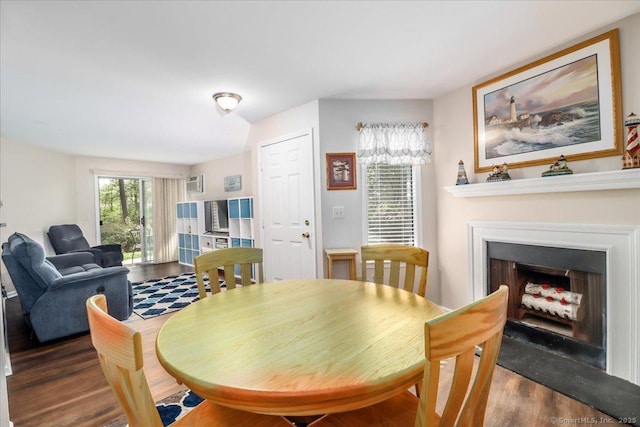 20 E Pembroke Rd Unit 36, Danbury, CT 06811 - dining room featuring a fireplace with flush hearth and wood finished floors