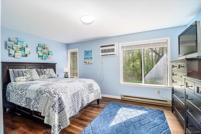 20 E Pembroke Rd Unit 36, Danbury, CT 06811 - bedroom with baseboards, an AC wall unit, wood finished floors, and baseboard heating