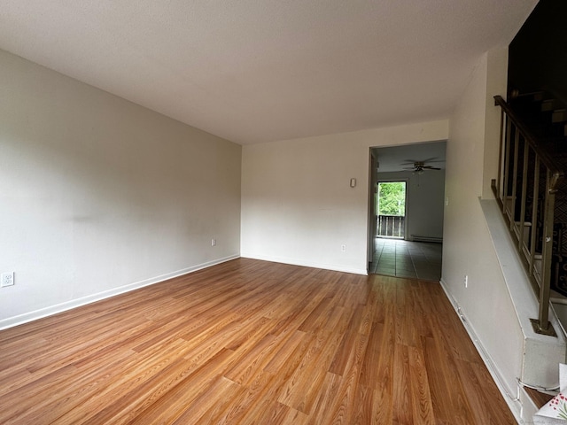 136 Westbury Park Rd Apt C, Watertown, CT 06795 - unfurnished room with wood finished floors, stairway, baseboards, and a ceiling fan