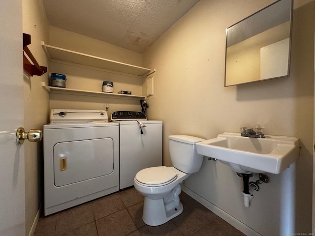 136 Westbury Park Rd Apt C, Watertown, CT 06795 - bathroom with a textured ceiling, washing machine and clothes dryer, toilet, baseboards, and tile patterned floors
