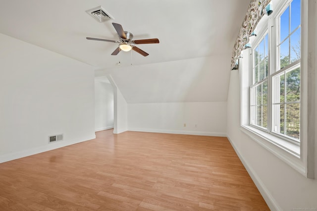 bonus room featuring baseboards, visible vents, light wood-type flooring, and ceiling fan