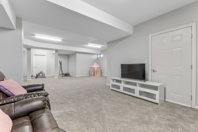 living room featuring baseboards and carpet floors