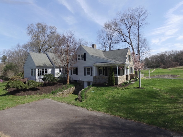 496 Foote Rd, Glastonbury, CT 06073 - view of side of property with a lawn, a chimney, and a shingled roof
