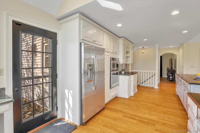 496 Foote Rd, Glastonbury, CT 06073 - kitchen featuring light wood-style floors, stainless steel appliances, recessed lighting, and arched walkways