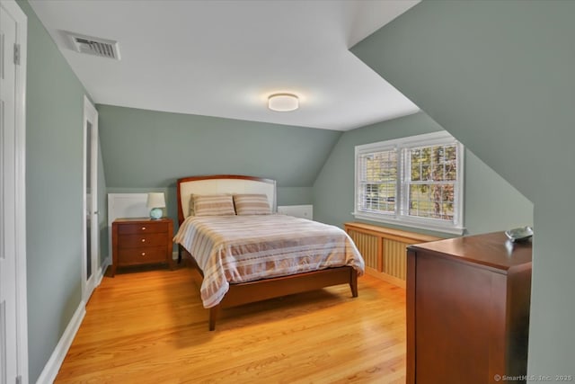 496 Foote Rd, Glastonbury, CT 06073 - bedroom featuring visible vents, baseboards, lofted ceiling, and light wood-type flooring