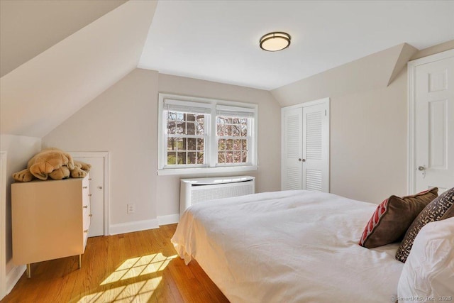496 Foote Rd, Glastonbury, CT 06073 - bedroom featuring lofted ceiling, a closet, wood finished floors, and baseboards