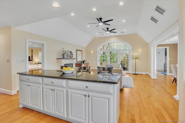 496 Foote Rd, Glastonbury, CT 06073 - kitchen featuring a ceiling fan, visible vents, white cabinetry, ornate columns, and open floor plan