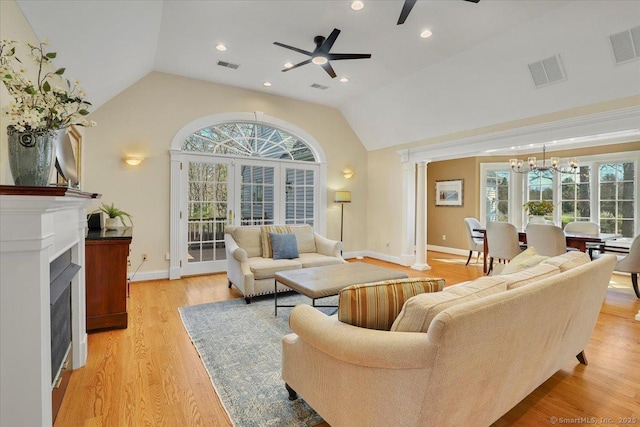 496 Foote Rd, Glastonbury, CT 06073 - living area with visible vents, ceiling fan with notable chandelier, and lofted ceiling