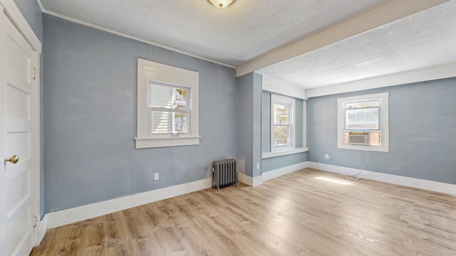 40 Penobscot St, Norwich, CT 06360 - empty room with a textured ceiling, radiator heating unit, wood finished floors, and baseboards