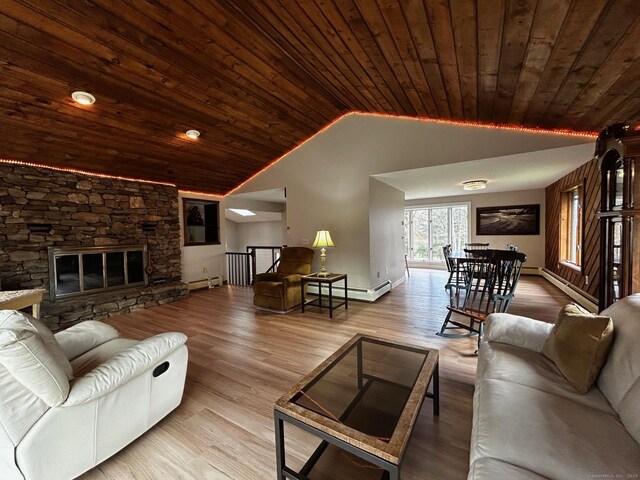 living room with a baseboard heating unit, vaulted ceiling, wood ceiling, and wood finished floors