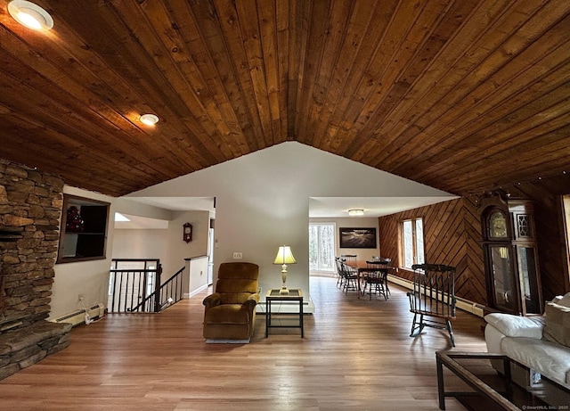 living room with vaulted ceiling, wooden ceiling, wood finished floors, and a baseboard radiator
