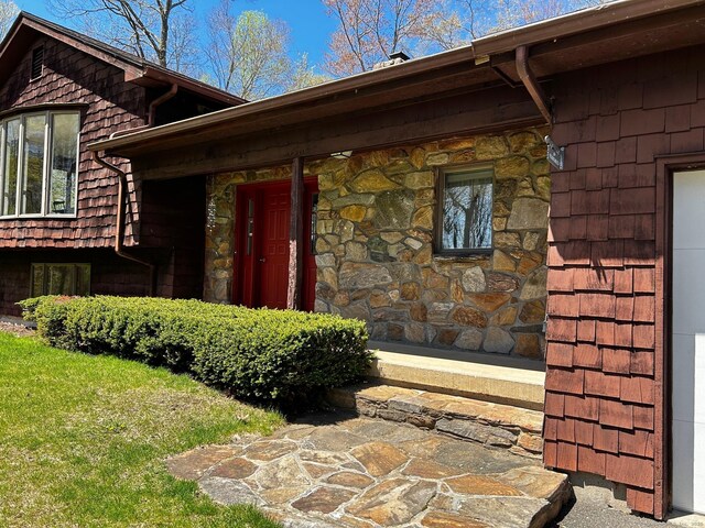 entrance to property with stone siding