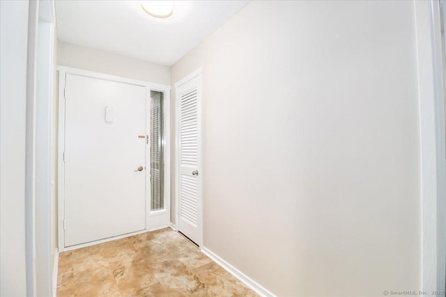 79 Heritage Vlg Unit B, Southbury, CT 06488 - doorway featuring baseboards
