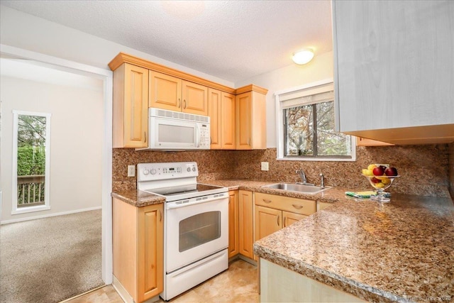 79 Heritage Vlg Unit B, Southbury, CT 06488 - kitchen with light brown cabinetry, white appliances, a healthy amount of sunlight, and a sink