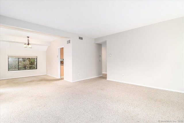 79 Heritage Vlg Unit B, Southbury, CT 06488 - unfurnished room featuring baseboards, visible vents, light carpet, and an inviting chandelier