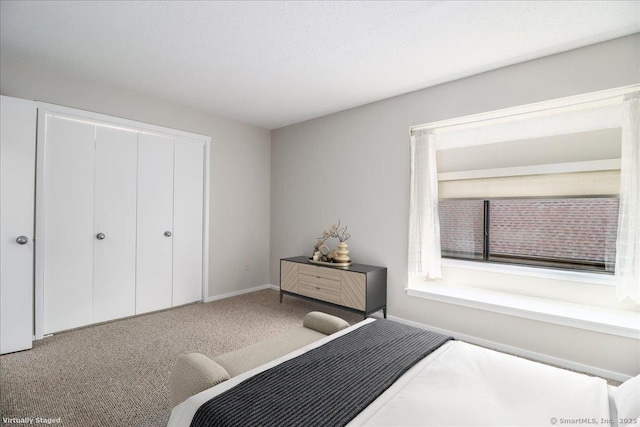 79 Heritage Vlg Unit B, Southbury, CT 06488 - bedroom with a closet, carpet floors, and baseboards