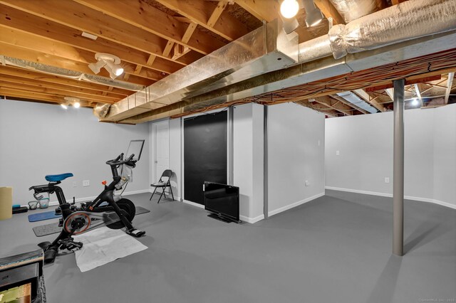 exercise room with baseboards