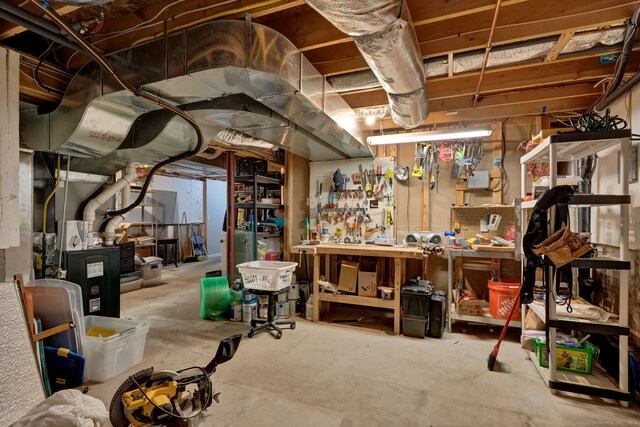 unfinished below grade area with a workshop area