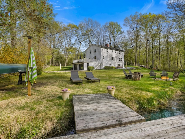 exterior space featuring a wooden deck and a yard
