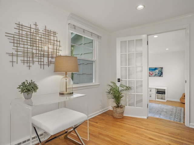 sitting room with crown molding, recessed lighting, baseboards, wood finished floors, and a baseboard radiator