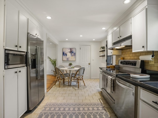 kitchen featuring appliances with stainless steel finishes, backsplash, baseboards, recessed lighting, and under cabinet range hood