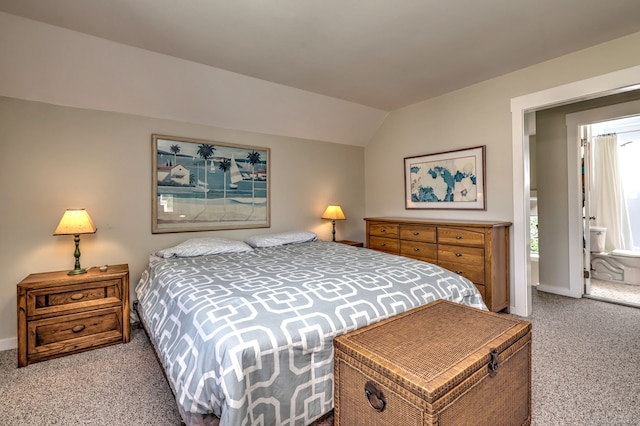 bedroom featuring baseboards, carpet, and vaulted ceiling