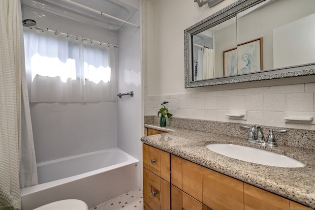 bathroom featuring toilet, shower / bath combo, and vanity