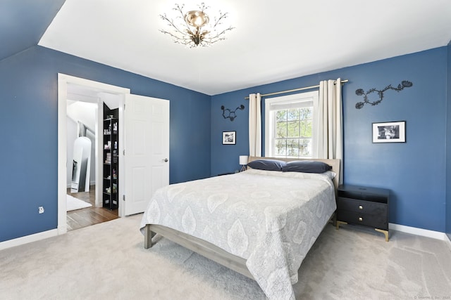 bedroom with baseboards and carpet flooring