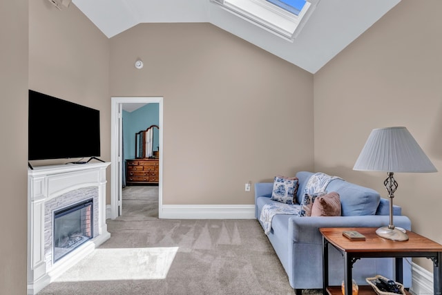living room with a skylight, light colored carpet, high vaulted ceiling, and baseboards