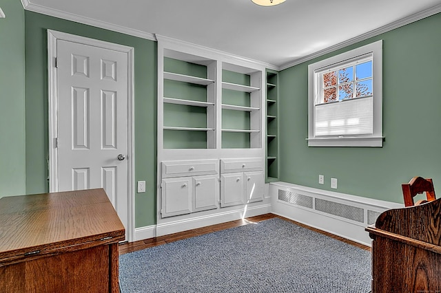 sitting room with dark wood finished floors and crown molding