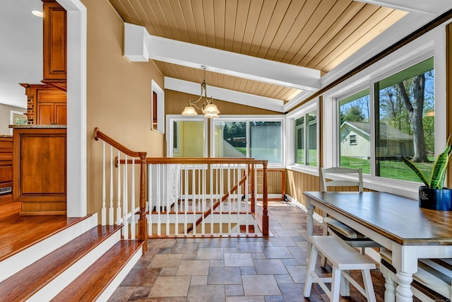 sunroom with a chandelier