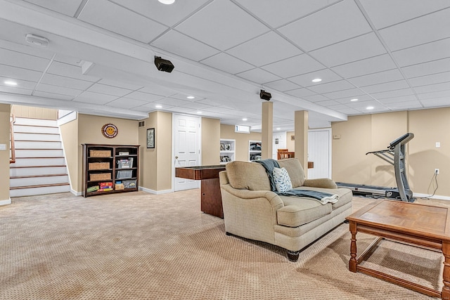 living room with baseboards, light carpet, stairs, a paneled ceiling, and recessed lighting