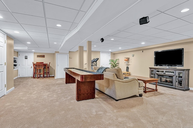 living area with carpet, recessed lighting, a drop ceiling, and baseboards