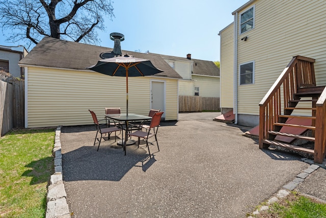 view of patio / terrace featuring outdoor dining area and fence