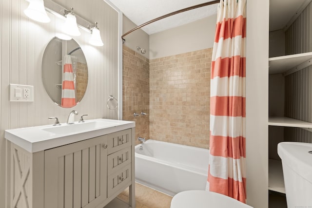 bathroom featuring tile patterned flooring, toilet, shower / bathtub combination with curtain, and vanity