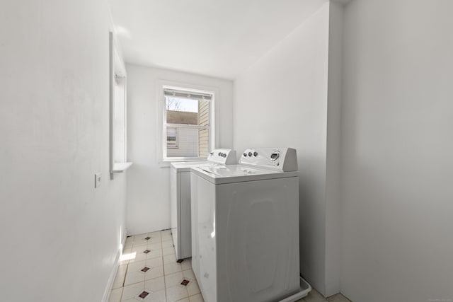 clothes washing area featuring washing machine and clothes dryer