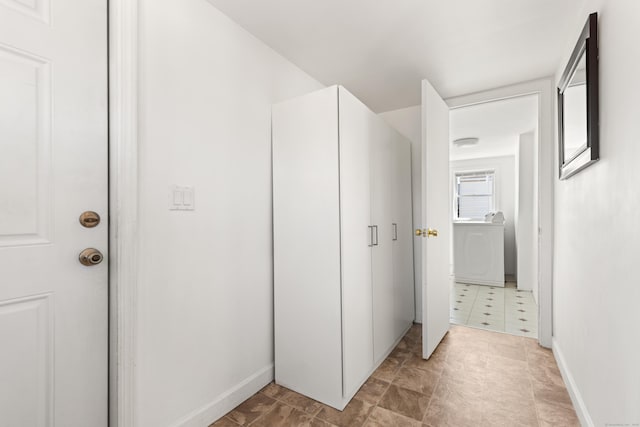 hallway with washer / clothes dryer
