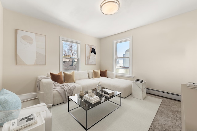 living area featuring light colored carpet, plenty of natural light, and baseboard heating