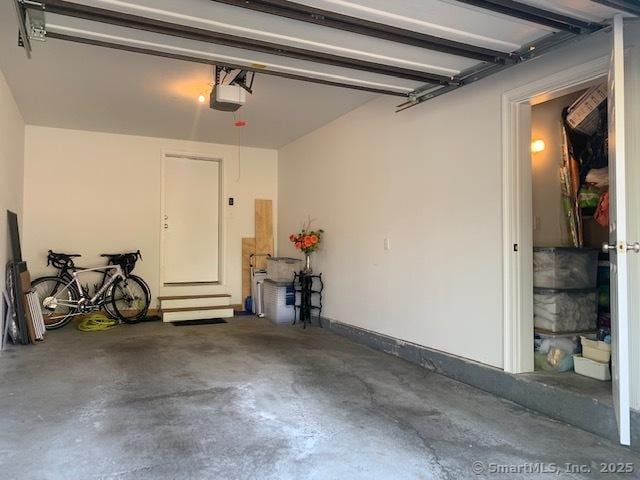 garage featuring a garage door opener
