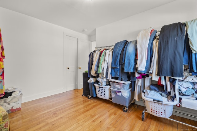 spacious closet with hardwood / wood-style floors