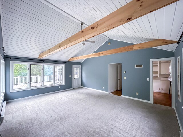 unfurnished living room featuring carpet and baseboards