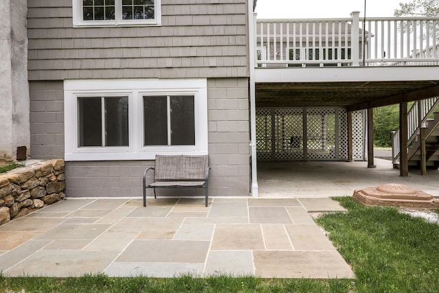 view of patio / terrace featuring stairs