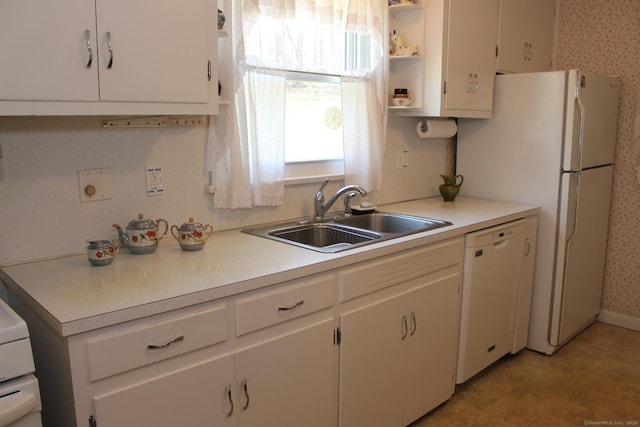 kitchen featuring white appliances, open shelves, light countertops, a sink, and white cabinetry