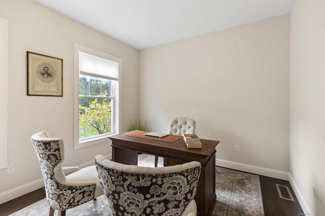 office area featuring baseboards, visible vents, and dark wood-type flooring