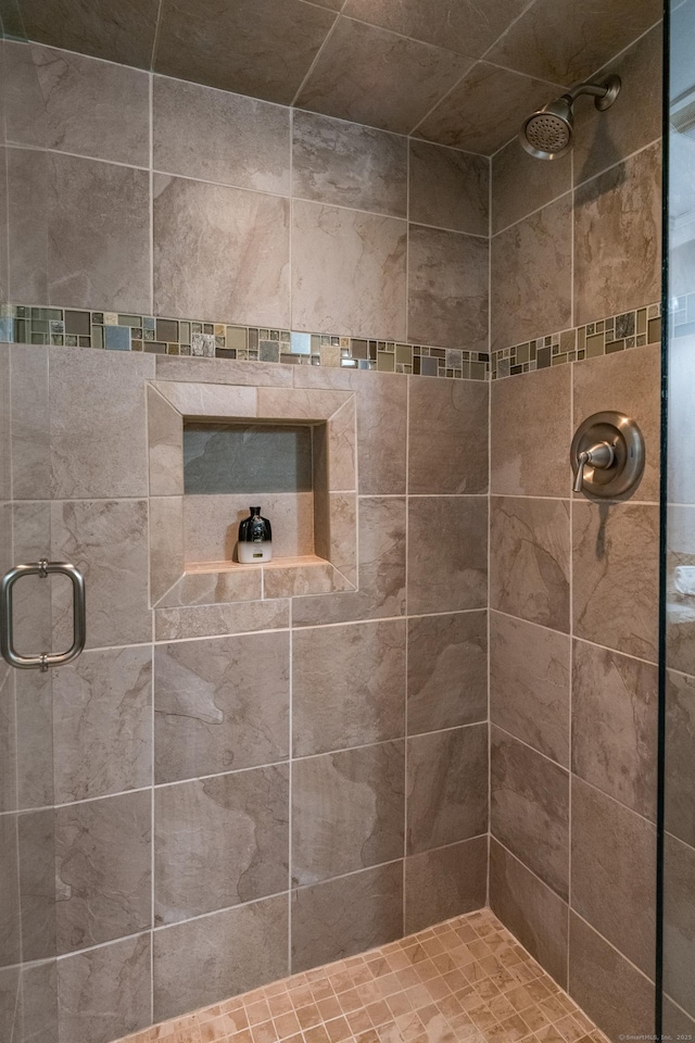 bathroom with a shower stall