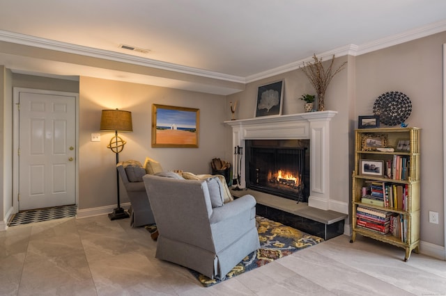 living area with baseboards, visible vents, a warm lit fireplace, and crown molding