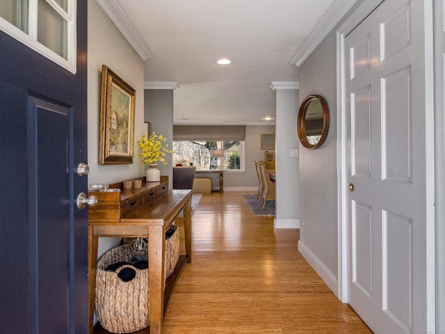 entrance foyer featuring baseboards, light wood-type flooring, ornamental molding, and recessed lighting