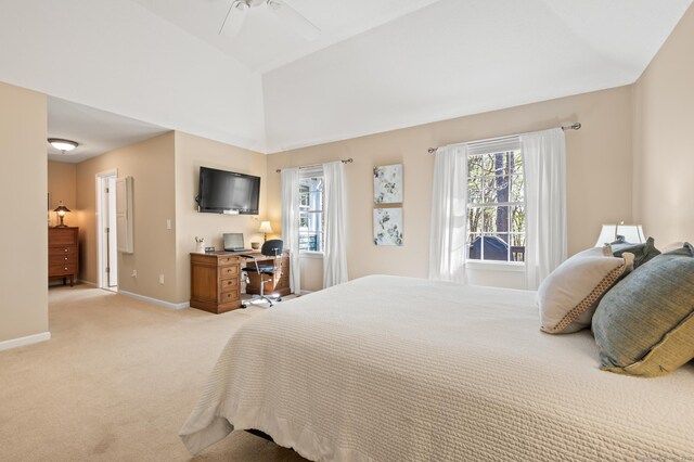 bedroom with baseboards, multiple windows, vaulted ceiling, light carpet, and ceiling fan