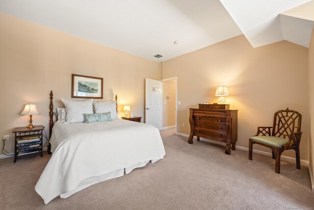 bedroom with light carpet, baseboards, and lofted ceiling