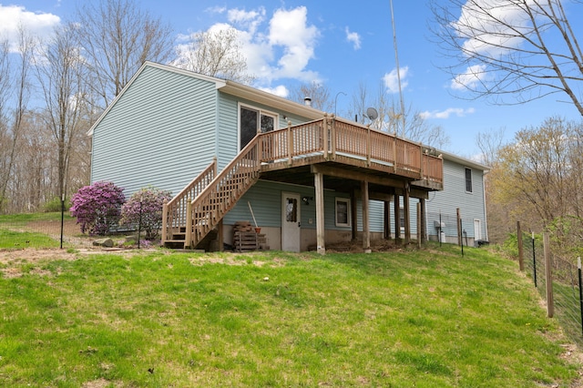 back of house with a lawn, stairway, fence, and a wooden deck
